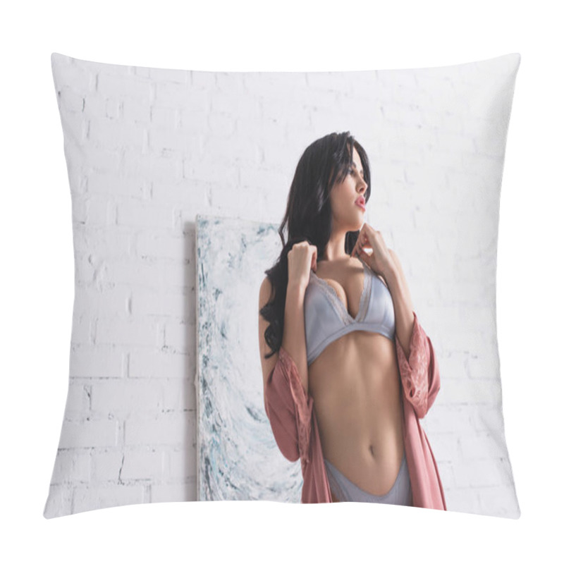 Personality  young seductive woman in bra and silk robe near painting on wall pillow covers