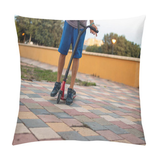 Personality  A Boy With A Scooter In The Park, Close-up On His Feet And The Scooter, Epitomizing The Joy Of Outdoor Activities And Childhood Play. Pillow Covers
