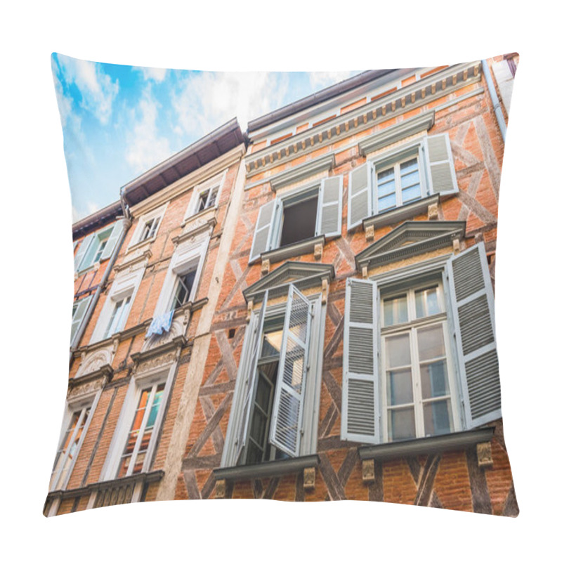Personality  Facade of a building rue Saint-Rome in Toulouse with its typical pink bricks, in Haute-Garonne in Occitanie, France pillow covers