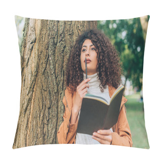 Personality  Selective Focus Of Dreamy Woman In Raincoat Holding Pen And Notebook Near Tree  Pillow Covers