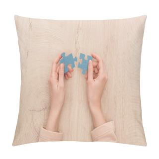 Personality  Cropped View Of Female Hands Holding Blue Puzzles On Wooden Table Pillow Covers