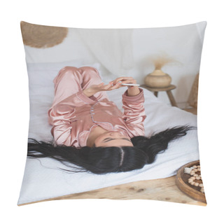Personality  Young Asian Woman In Silk Pajamas Lying On Bed With Cellphone In Bedroom Pillow Covers