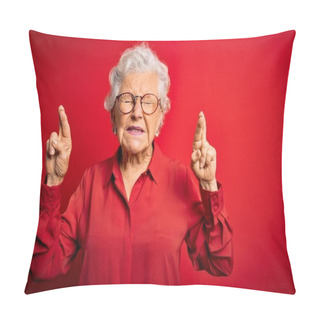 Personality  Senior Beautiful Grey-haired Woman Wearing Casual Shirt And Glasses Over Red Background Gesturing Finger Crossed Smiling With Hope And Eyes Closed. Luck And Superstitious Concept. Pillow Covers