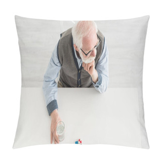 Personality  Overhead View Of Pensive Man Looking Away, Sitting Behind Table With Pills And Water In Glass Pillow Covers