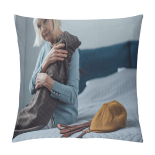 Personality  Sad Senior Woman Sitting On Bed And Holding Jacket At Home Pillow Covers