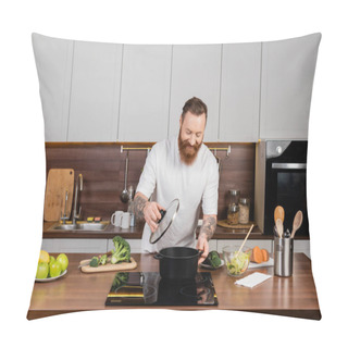 Personality  Tattooed Man Holding Cap Near Pot On Stove And Food In Kitchen  Pillow Covers