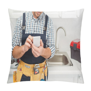 Personality  Cropped View Of Workman In Tool Belt Using Smartphone While Working In Kitchen  Pillow Covers