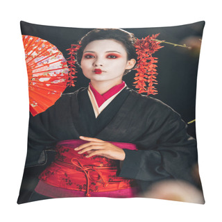 Personality  Selective Focus Of Beautiful Geisha In Black Kimono With Red Flowers In Hair Holding Hand Fan And Sakura Branches Isolated On Black Pillow Covers