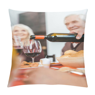 Personality  Cropped Shot Of Senior Couple Sitting At Holiday Table While Man Pouring Wine On Foreground Pillow Covers