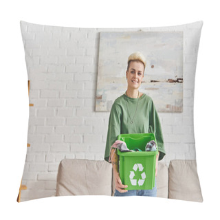Personality  Pleased, Tattooed Young Woman In Casual Clothes Holding Green Recycling Box With Garments And Looking At Camera In Modern Living Room, Sustainable Living And Environmentally Friendly Habits Concept Pillow Covers