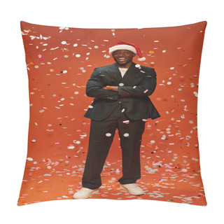 Personality  Excited African American Man In Black Suit And Santa Hat Smiling Under Confetti On Red Backdrop Pillow Covers