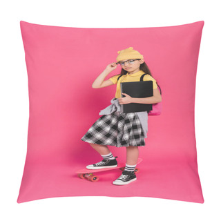 Personality  Schoolgirl In Beanie Hat And Glasses Holding Notebooks, Standing Near Penny Board On Pink Background Pillow Covers