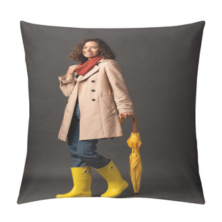 Personality  Smiling Woman In Trench Coat And Rubber Boots Holding Yellow Umbrella On Black Background Pillow Covers