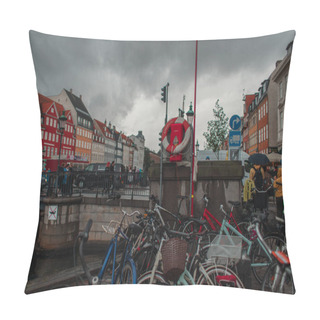Personality  COPENHAGEN, DENMARK - APRIL 30, 2020: Bicycles Near Canal On Nyhavn Harbor With Cloudy Sky At Background  Pillow Covers