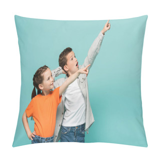 Personality  Happy Girl And Amazed Boy Pointing With Fingers While Looking Away Isolated On Blue Pillow Covers
