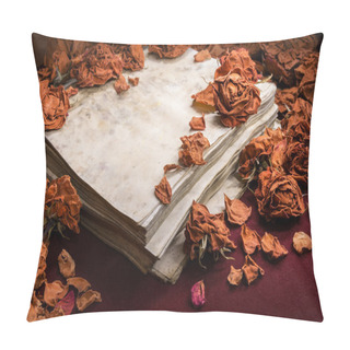 Personality  Background In Retro Style. Dry Roses Scattered On Old Book Pillow Covers