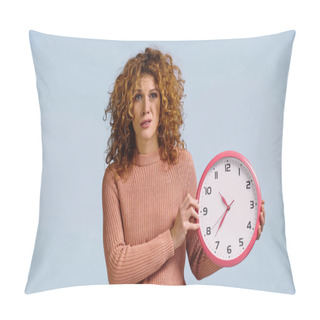Personality  Displeased Woman Holding Round Clock And Looking At Camera Isolated On Blue Pillow Covers