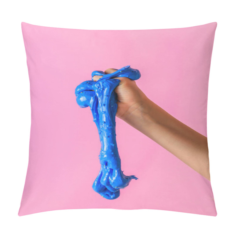 Personality  An Blue Slime Flows Down From The Baby's Hand On A Pink Background. Toy Antistress. Toy For The Development Of Hand Motor Skills. Pillow Covers