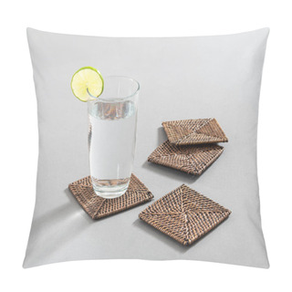 Personality  Glass Of Water With Lemon Beside Wicker Coasters Set On Grey Background. Pillow Covers