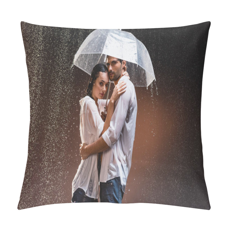 Personality  young couple in wet shirts standing under rain with transparent umbrella on dark background pillow covers