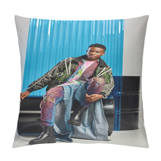 Personality  Full Length Of Young And Stylish Afroamerican Model In Outwear Jacket With Led Stripes And Ripped Jeans Looking At Camera While Sitting Near Blue Polycarbonate Sheet On Grey, DIY Clothing  Pillow Covers