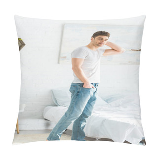 Personality  Handsome Man In White T-shirt And Jeans Standing Near Bed At Home Pillow Covers