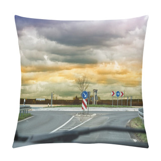 Personality  Looking Through The Windshield Of A Car On The Road. When Approaching A Car Roundabouts With Dramatic Sky In The Background. Pillow Covers