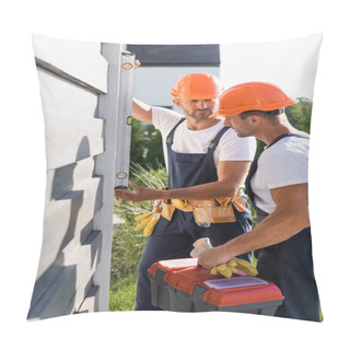 Personality  Selective Focus Of Workmen With Tools Using Spirit Level While Working With Facade Of Building  Pillow Covers