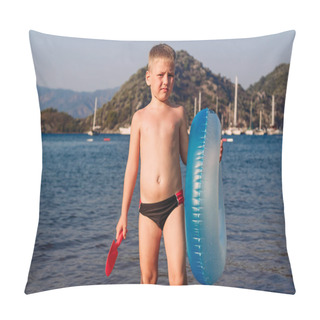 Personality  A Six Year Old Tanned Boy Stands Holding A Swimming Circle And A Pillow Covers