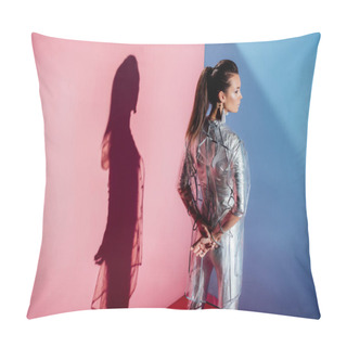 Personality  Rear View Of Stylish Girl Posing In Silver Bodysuit And Trendy Raincoat On Pink And Blue Background Pillow Covers