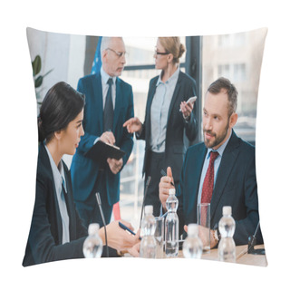 Personality  Selective Focus Of Diplomats Talking And Gesturing Near Glasses On Table  Pillow Covers