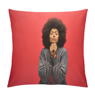 Personality  Stylish Man With Curly Hairdostanding Confidently Against Bold Red Backdrop. Pillow Covers