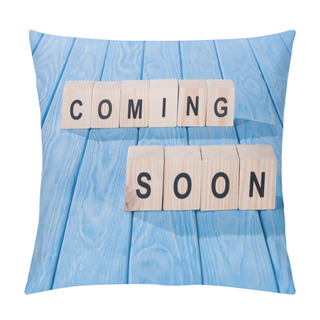 Personality  Close Up View Of Arranged Wooden Blocks Into Coming Soon Phrase On Blue Wooden Surface  Pillow Covers