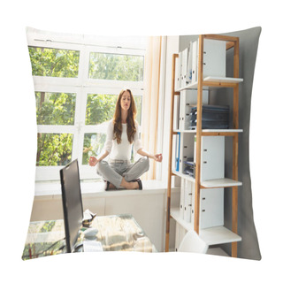 Personality  Relaxed Young Businesswoman Meditating In Lotus Position Over Cabinet Near Window Pillow Covers
