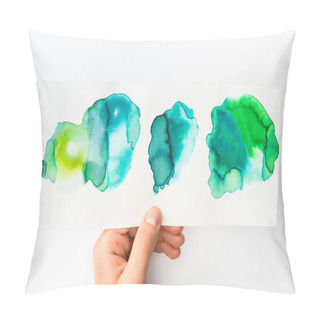 Personality  Man Holding Paper With Abstract Watercolor Blue And Green Spills On White Background Pillow Covers