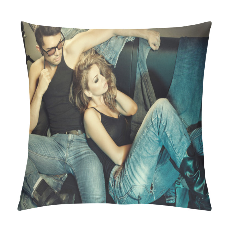 Personality  Sexy man and woman dressed in jeans doing a fashion photo shoot in a professional studio pillow covers