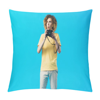 Personality  Shocked Curly Teenager Holding Film Camera Isolated On Blue Pillow Covers