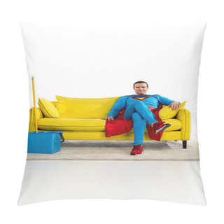 Personality  Smiling Male Superhero Sitting On Couch Near Bucket And Mop On White Pillow Covers