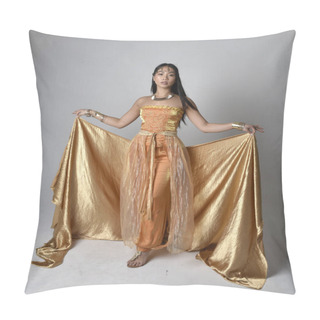 Personality  Full Length Portrait Of Pretty Young Asian Woman Wearing Golden Arabian Robes Like A Genie, Standing Pose Holding Flowing Fabric, Isolated On Studio Background. Pillow Covers
