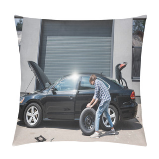 Personality  Man Rolling New Wheel And Fixing Broken Auto Near Garage, Car Insurance Concept Pillow Covers