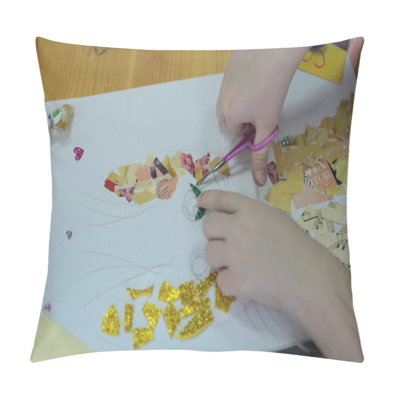 Personality  Nizhny Novgorod, Volga Region / Russia - March 04, 2020: hands of children lesson applications in the office for fine arts cutting and pasting figures, patterns or whole pictures from pieces of colorful paper pillow covers