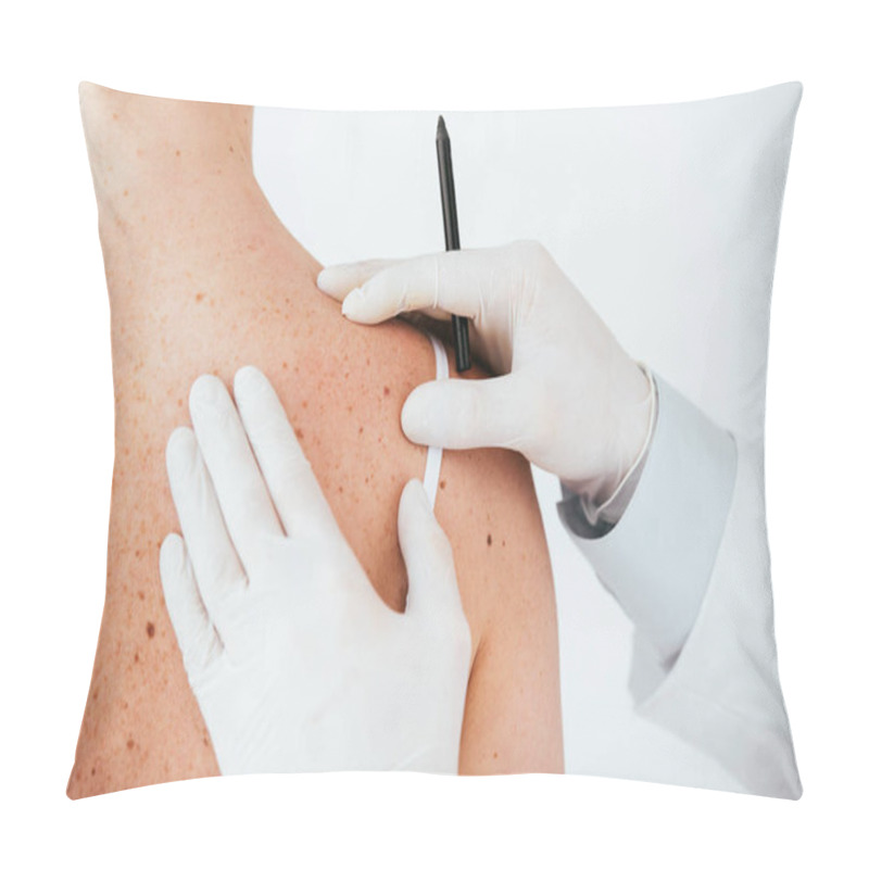 Personality  cropped view of dermatologist in latex gloves holding marker pen near woman with melanoma isolated on white  pillow covers