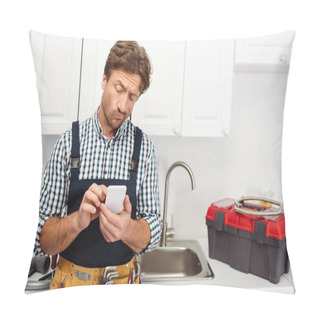 Personality  Pensive Plumber Using Smartphone Near Toolbox And Sink In Kitchen  Pillow Covers