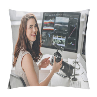 Personality  Cheerful Art Editor Holding Digital Camera Near Table With Computer Monitors  Pillow Covers