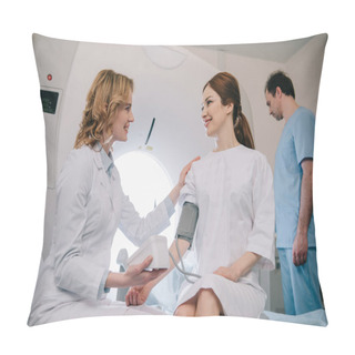 Personality  Smiling Doctor Measuring Patients Blood Pressure With Tonometer While Assistant Adjusting Ct Scanner Pillow Covers