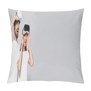 Personality  Website Header Of Excited Interracial Couple In White T-shirts Looking Away With Open Mouths While Touching Vr Headsets On Grey Pillow Covers