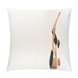 Personality  A Graceful Woman Defies Gravity In A Captivating Pose Against A Clean White Background. Pillow Covers