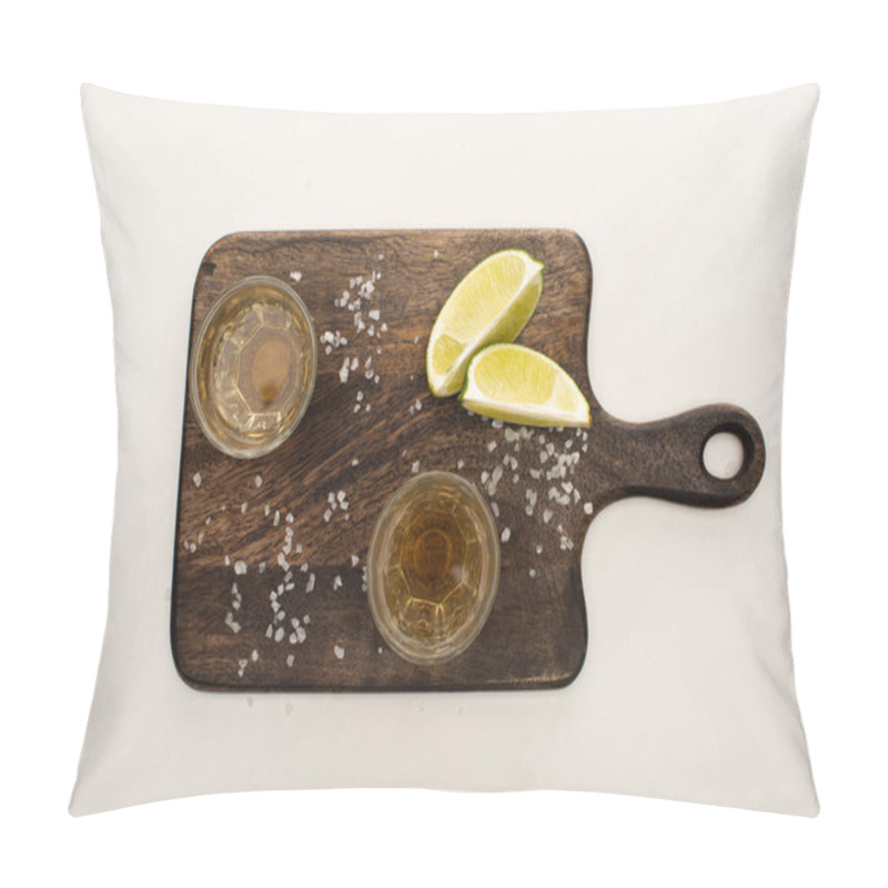 Personality  top view of golden tequila with lime, salt on wooden cutting board on white marble surface pillow covers