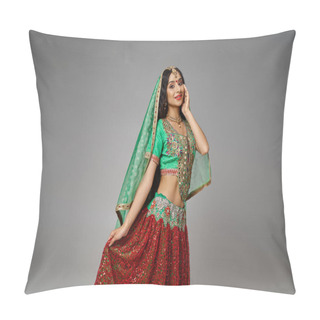 Personality  Joyous Indian Woman In Green Choli Touching Hem Of Her Red Skirt Posing With Hand On Cheek Pillow Covers