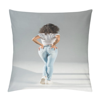 Personality  Back View Of Woman Standing With Hands In Pockets In Tight Blue Jeans On Grey Background Pillow Covers